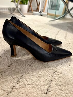 Black leather pumps